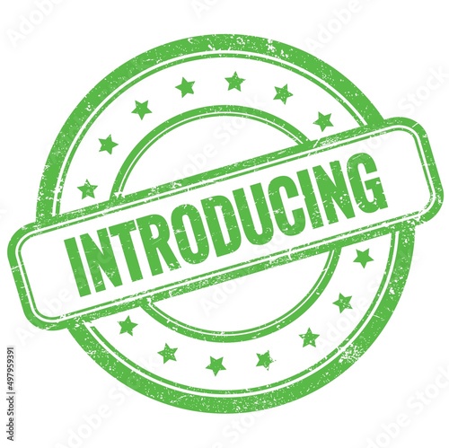 INTRODUCING text on green grungy round rubber stamp.