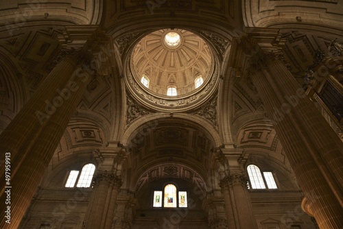 Elegantly coffered and decorated main dome above the transept of Jaén Cathedral, embedded in an ensemble of columns and vaults expressing pure Spanish Renaissance style, Jaén, Spain
