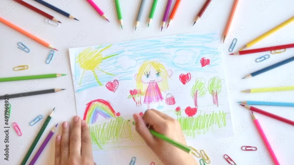 A child draws a postcard for mother's day. Beautiful landscape with mom drawn with pencils A child draws a postcard for mother's day. Beautiful landscape with mom drawn with pencils