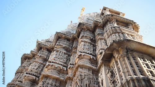 Jagdish Temple with blue sky located at Udaipur, Rajasthan, India. Ancient Hindu temple with beautiful carving on wall. photo