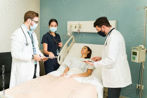 Medical team checking on a young woman