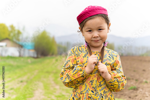girl in a national headdress. Spring, Nowruz holiday. Kazakh girl. Central Asia, Kazakhstan.