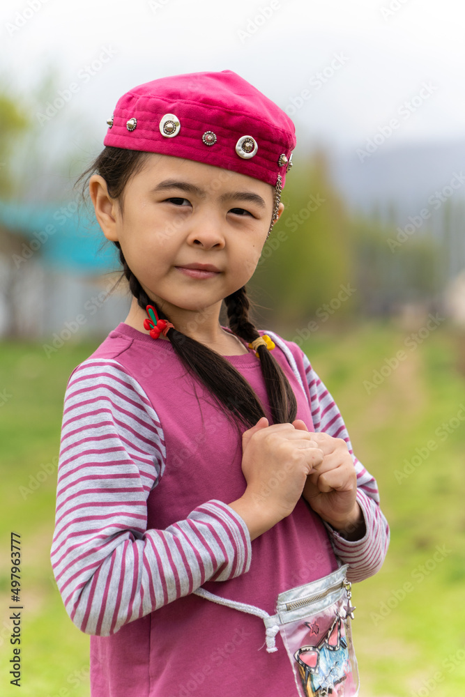 girl in a national headdress. Spring, Nowruz holiday. Kazakh girl. Central Asia, Kazakhstan. girl in a national headdress. Spring, Nowruz holiday. Kazakh girl. Central Asia, Kazakhstan.