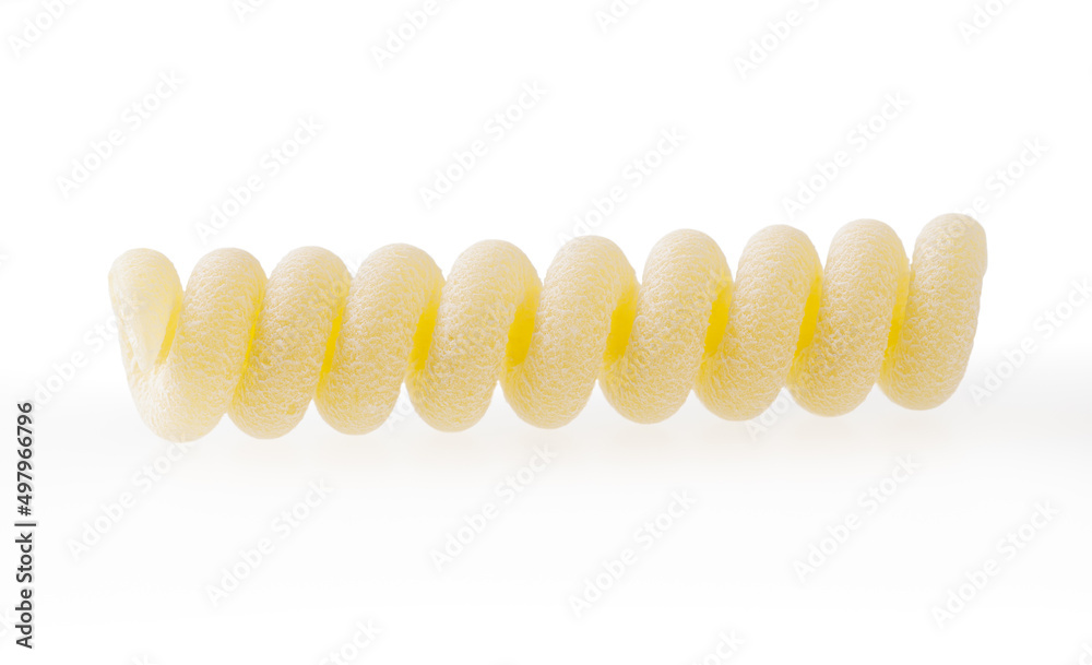 Uncooked fusilli corti bucati pasta isolated on white background with clipping path