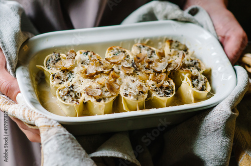 Cannelloni with mushroom stew and chestnuts. Author's Corsican cuisine. Cannelloni in a baking dish