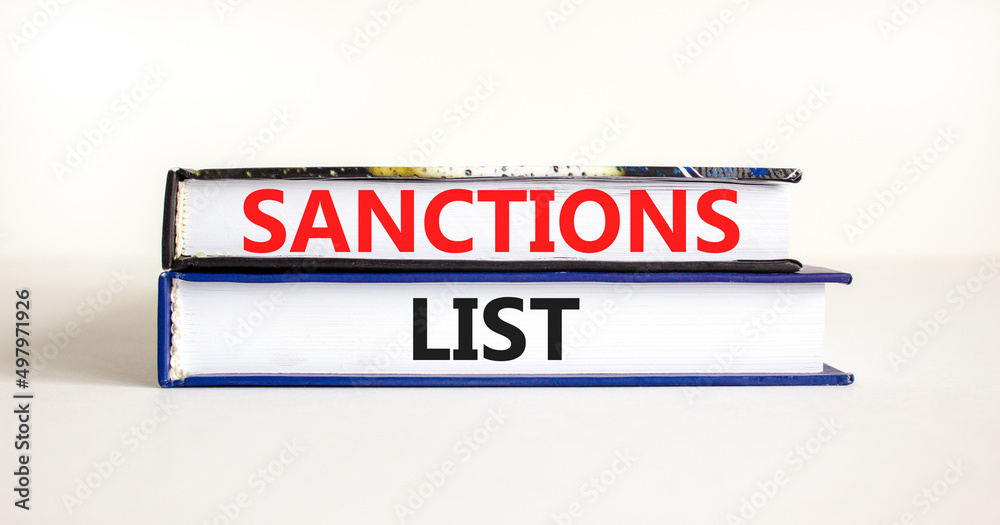 Sanctions list symbol. Books with concept words Sanctions list on beautiful white background. Business political sanctions list concept. Copy space.