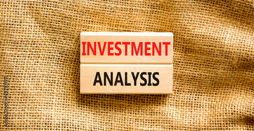 Investment analysis symbol. Wooden blocks with concept words Investment analysis on beautiful canvas background. Business investment analysis concept. Copy space. photo