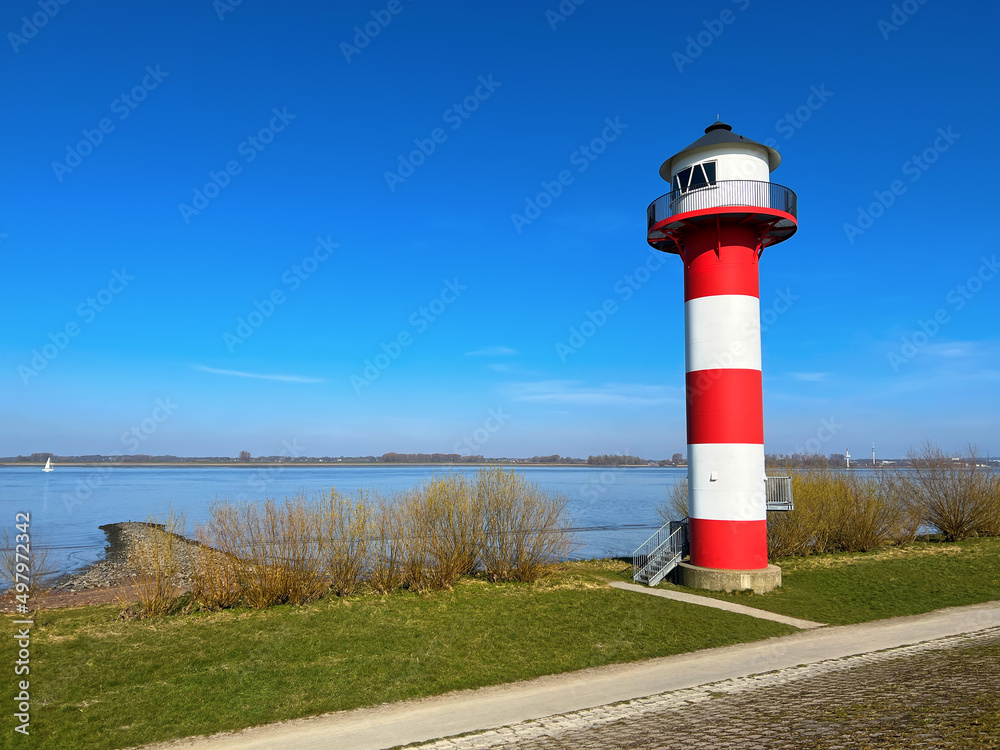 Lighthouse on colorful landscape