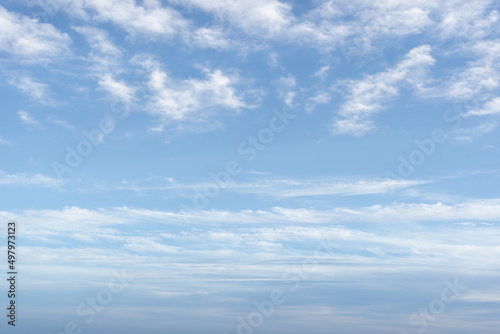 White mixed clouds on summer day. Altocumulus clouds are full of streaks of beautiful, between lower stratus clouds and higher cirrus clouds. no focus