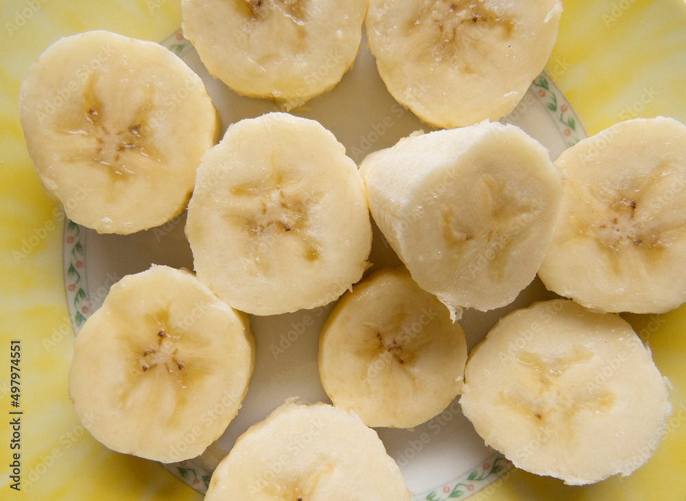 Banana bunch and peeled pieces photo Tropical fruits, banana snack or vegetarian nutrition. Top view Banana bunch and peeled pieces photo Tropical fruits, banana snack or vegetarian nutrition. Top view