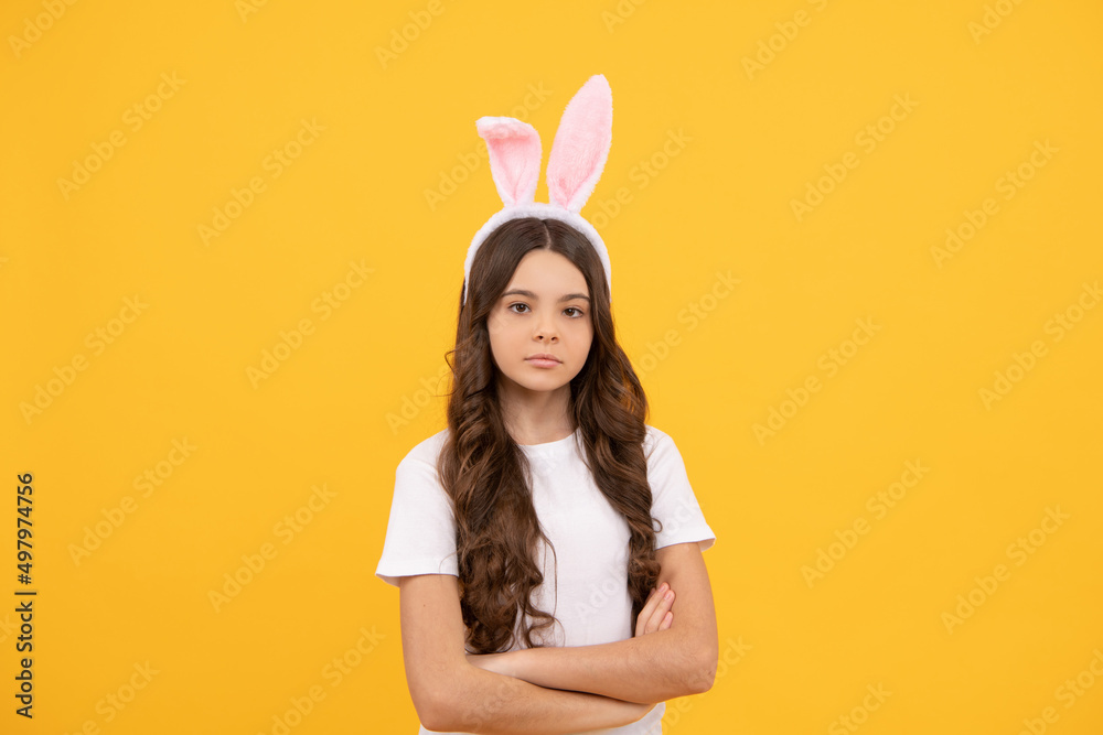 child in bunny ears on yellow background, easter child in bunny ears on yellow background, easter