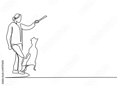 a dog and her owner playing outside together and having a good time