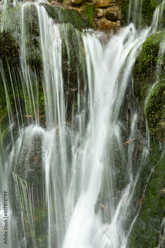 waterfall in the mountains of Chechnya in the spring in a picturesque forest