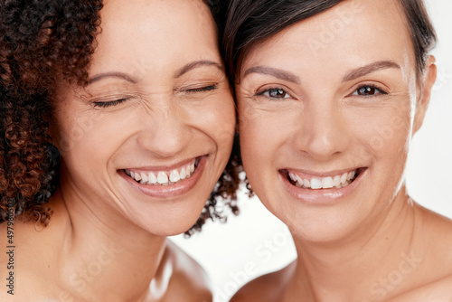Beauty is happiness. Cropped shot of two beautiful mature women posing against a grey background in studio.