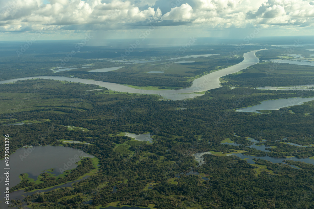 Aerial photo of the Amazon rainforest and the Amazon River basin in Brazil.