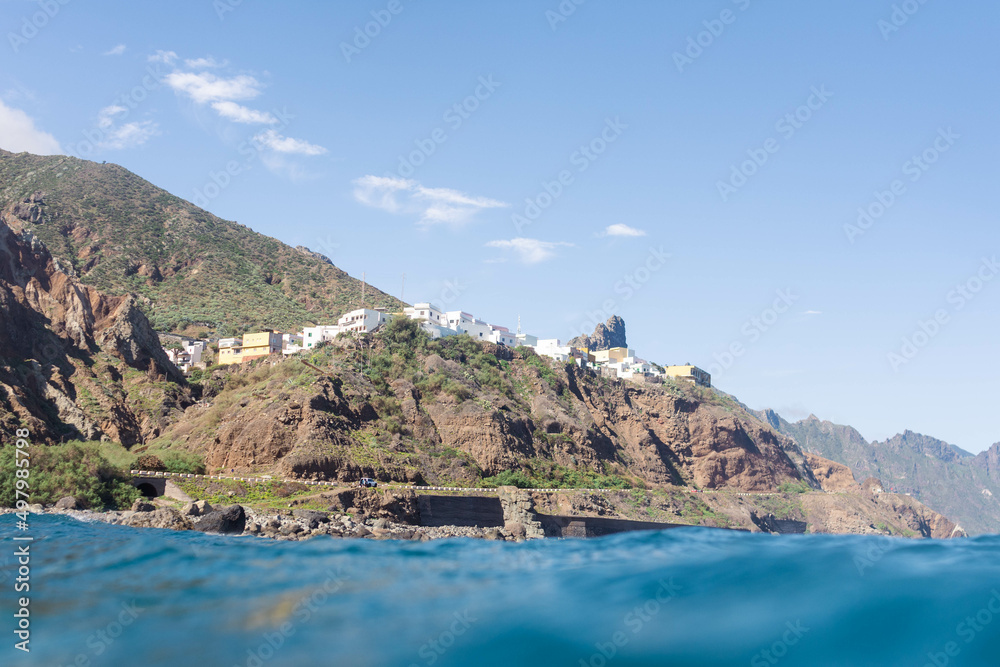Low angle view of the town of Almaciga in Tenerife. Beautiful coastal town seen from the sea