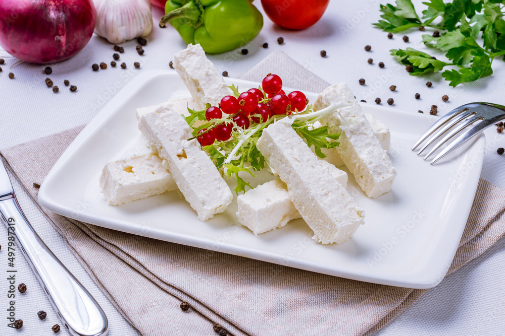 cheese cubes brinsa, brinza sliced cubes on a white plate cheese cubes brinsa, brinza sliced cubes on a white plate