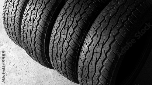 Part of mud all-terrain truck tire closeup on white background