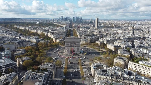 Drone view of downtown Paris with the Arc de Triomphe in the center of the frame