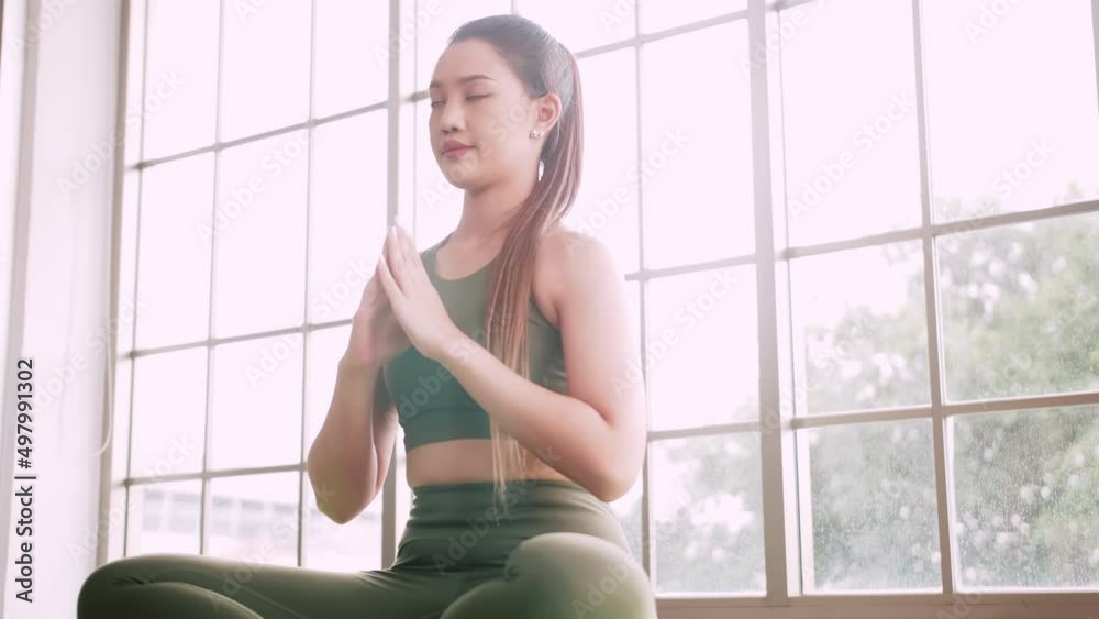Young Asian woman exercise every morning to stay healthy. Young Asian woman exercise every morning to stay healthy.