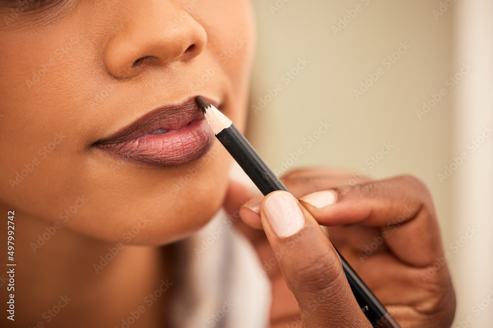 All a girl needs is a good lipliner. Cropped shot a woman applying lipliner.