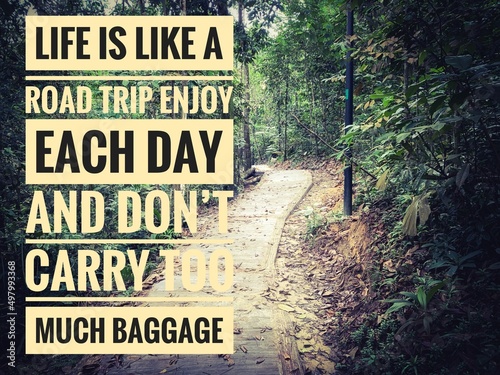 Motivational and Inspiration quote text - Life is like a road trip enjoy each day and don't carry too much baggage. With hiking Trail pathway background. Motivational concept