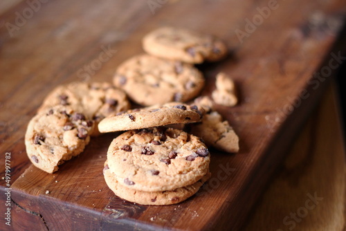Delicious chocolate cookies placed on a wooden table