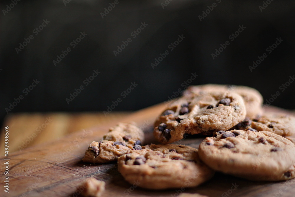 Delicious chocolate cookies placed on a wooden table Delicious chocolate cookies placed on a wooden table