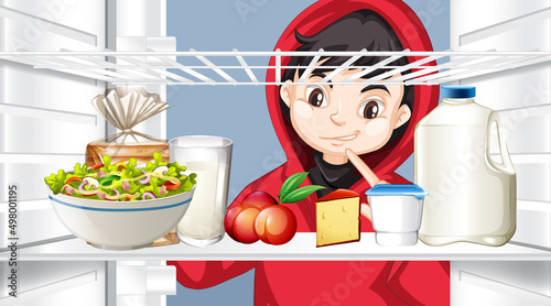 Boy looking at food in fridge