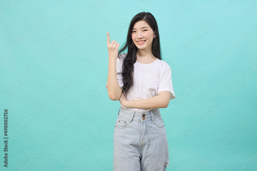 young asian woman isolated on blue background young asian woman isolated on blue background