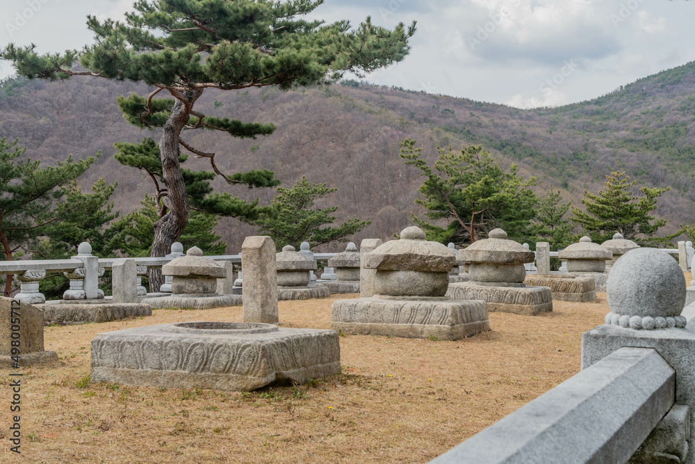Stone carved placenta jars in Korean wilderness park.