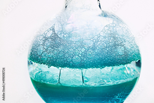 Glass flask with a chemical reagent. photo