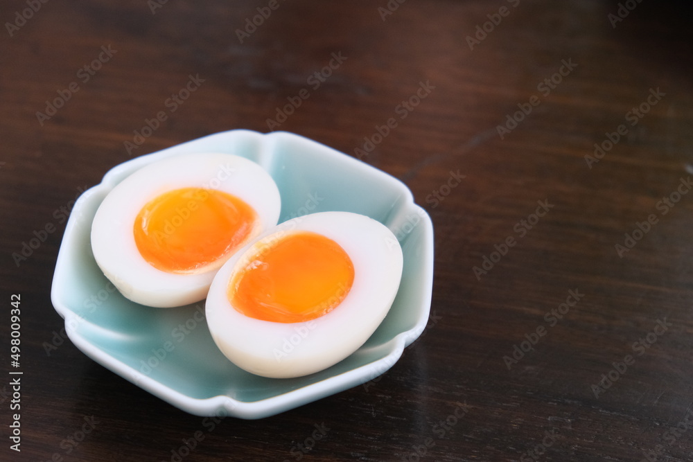 close up a dish of soft boiled egg on table. close up a dish of soft boiled egg on table.