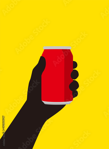 Hand holding a tin of coke