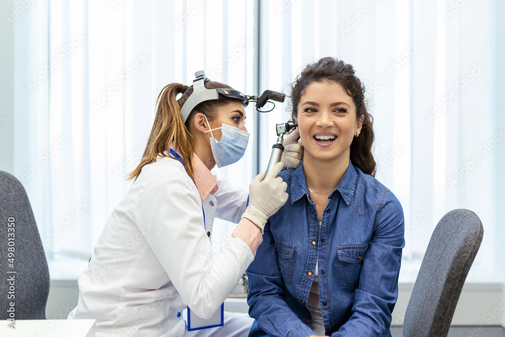 Hearing Exam. Otolaryngologist Doctor Checking Woman's Ear Using ...