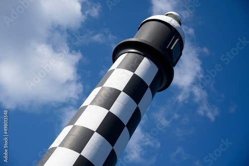Lighthouse with black and white chequer design photo