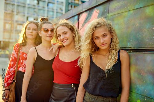 Lined up in the city. Cropped portrait of a group of attractive young girlfriends having a great time out in the city.