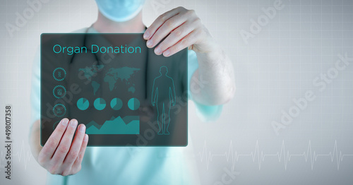 Organ Donation. Doctor holding virtual letter with text and an interface. Medicine in the future