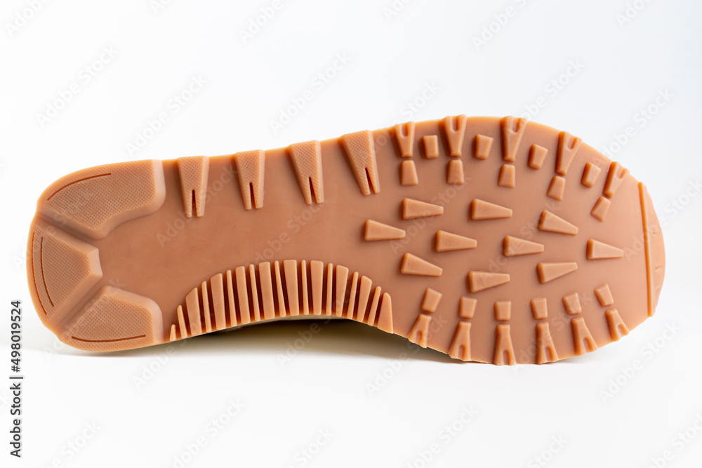 Brown grooved sole sneaker on a white background. selection of comfortable and beautiful fashionable shoes. online shoe store. Brown grooved sole sneaker on a white background. selection of comfortable and beautiful fashionable shoes. online shoe store.