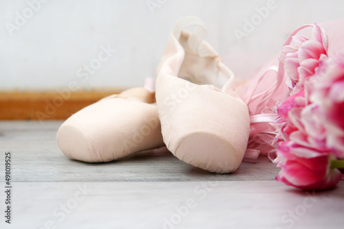 ballet, pointe shoes, tutu and bouquet of flowers photo