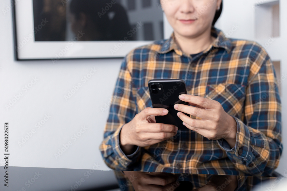 using cell phone hand holding mobile texting message contact us.chatting,search internet information in office.technology device communication connecting using cell phone hand holding mobile texting message contact us.chatting,search internet information in office.technology device communication connecting