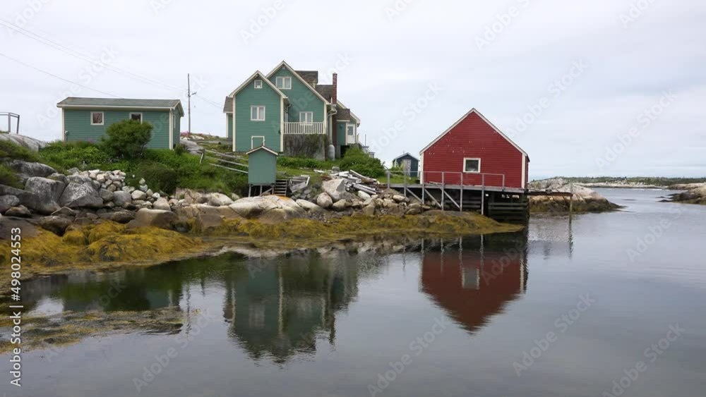 Fishing Village in Canada. Colourful homes boats that populate the picturesque fishing village of Peggy's Cove, Nova Scotia. Fishing Village in Canada. Colourful homes boats that populate the picturesque fishing village of Peggy's Cove, Nova Scotia.