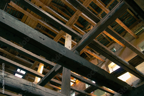 parallel wooden beams in an abandoned building