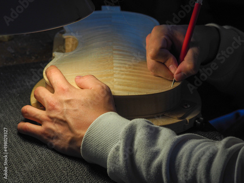 Obraz na plátně luthier working on a new violin in his workshop
