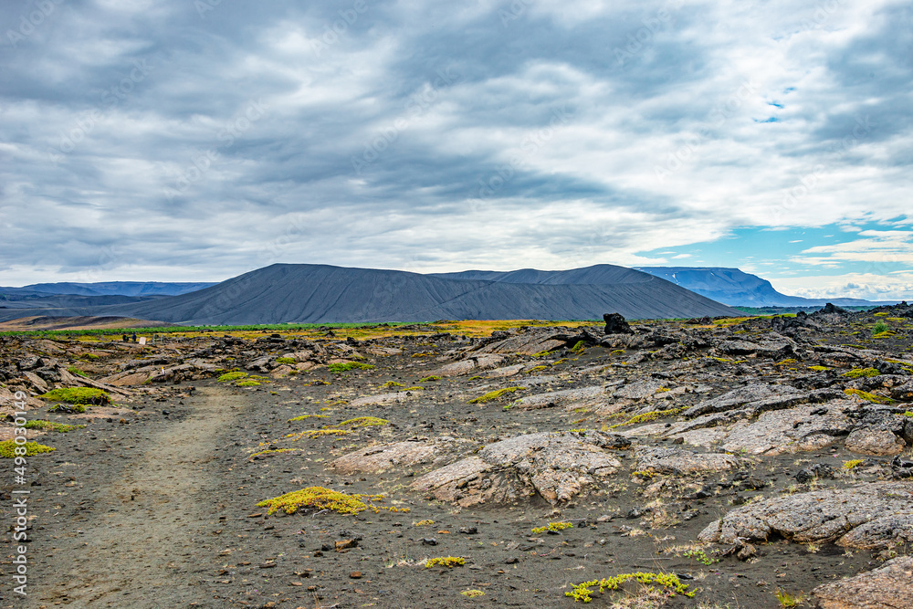 Hiking trail through Hverfjall volcano with classic crater near