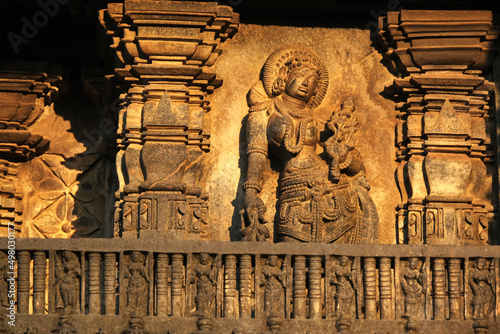 Stone Sculpture of Beautiful Female (Madanikas) with selective focus, 12th century Hindu temple, Ancient stone art and sculptures in each pillars, Chennakeshava Temple, Belur, Karnataka, India. © Vinayak Jagtap