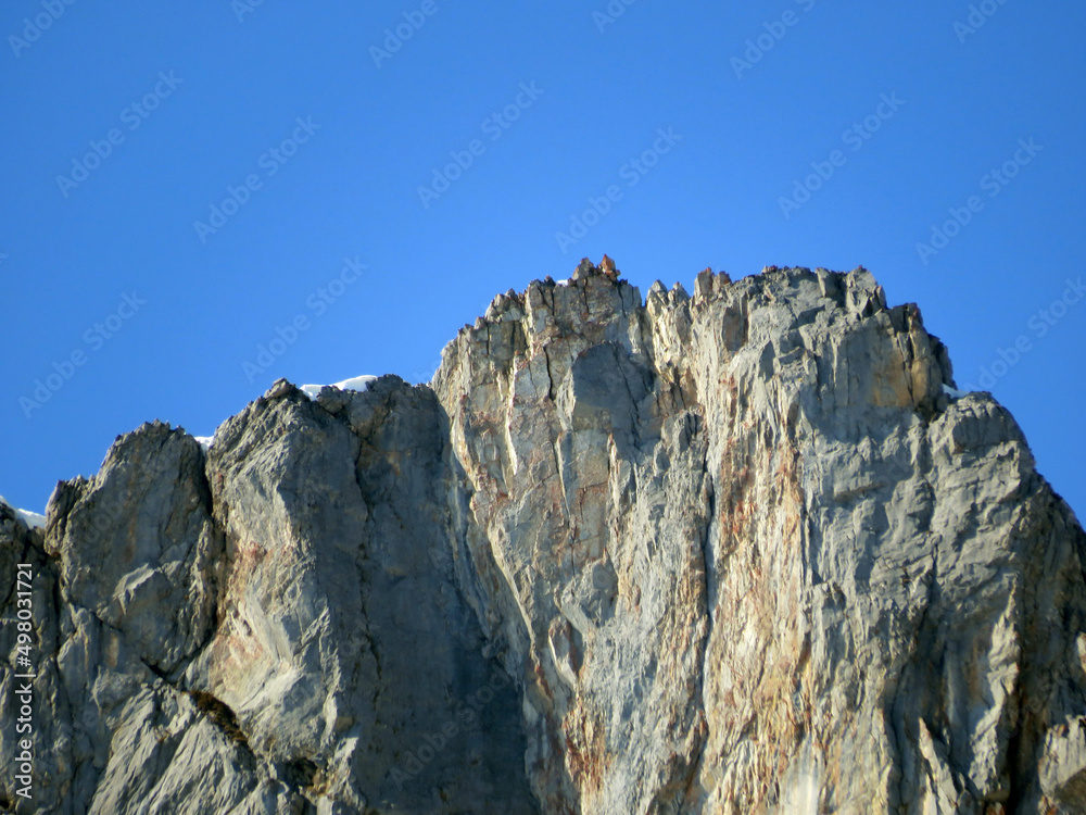 Rocky peak Mutteristock (2295 m) in the in the Schwyz Prealps mountain range, and over the Wägitalersee reservoir lake (Waegitalersee or Wagitaler lake) - Canton of Glarus, Switzerland (Schweiz) Rocky peak Mutteristock (2295 m) in the in the Schwyz Prealps mountain range, and over the Wägitalersee reservoir lake (Waegitalersee or Wagitaler lake) - Canton of Glarus, Switzerland (Schweiz)