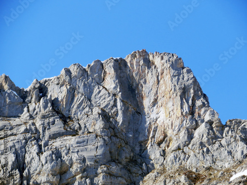 Rocky peak Mutteristock (2295 m) in the in the Schwyz Prealps mountain range, and over the Wägitalersee reservoir lake (Waegitalersee or Wagitaler lake) - Canton of Glarus, Switzerland (Schweiz)