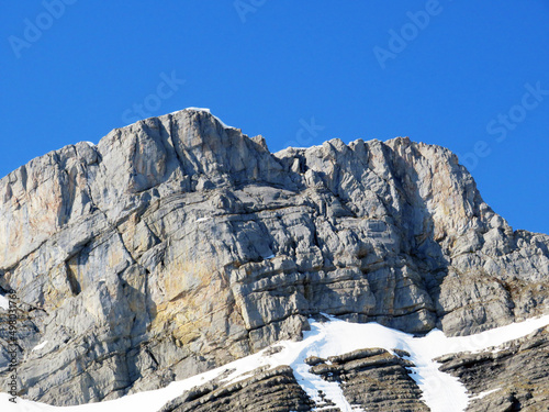 Rocky peak Mutteristock (2295 m) in the in the Schwyz Prealps mountain range, and over the Wägitalersee reservoir lake (Waegitalersee or Wagitaler lake) - Canton of Glarus, Switzerland (Schweiz) photo