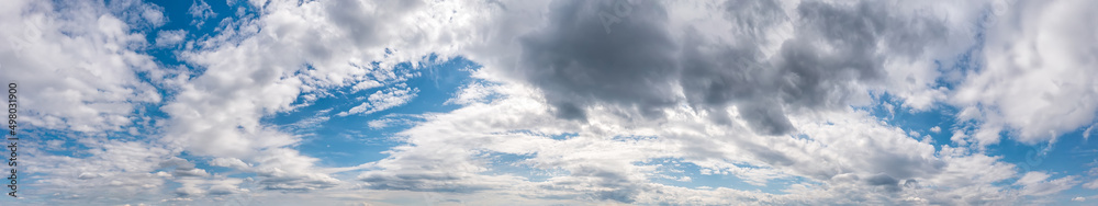 Panoramic view of blue sky with stunning stormy clouds Panoramic view of blue sky with stunning stormy clouds